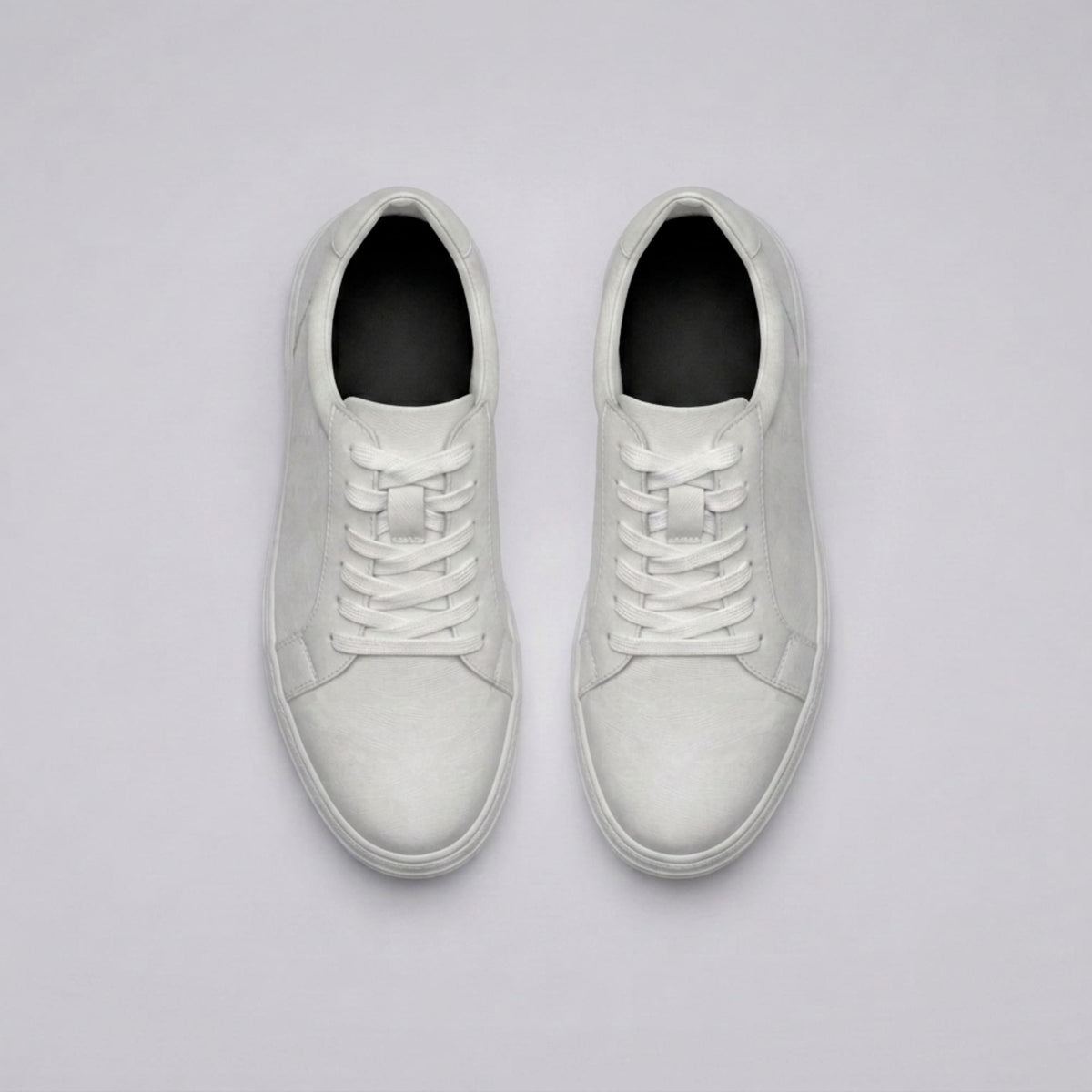 FORCIANO ATHENA white women's elevator sneakers shown as a pair from the top, featuring premium leather uppers, white laces and dark interior footbeds.