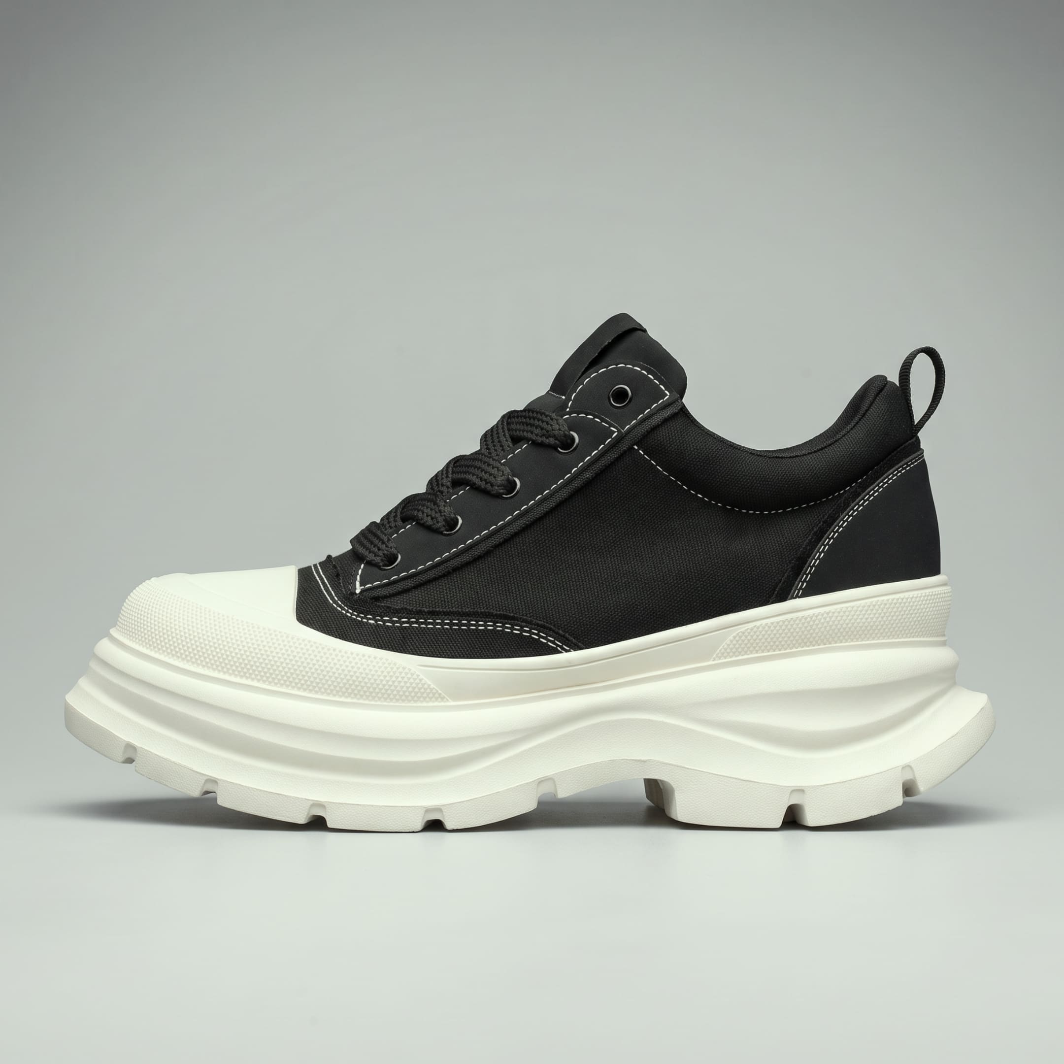 FORCIANO ATLAS Black Elevator Sneakers that add height up to 10 cm / 3.95 inches, shown in side profile with a canvas and leather upper and White sole.