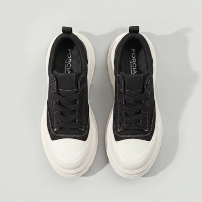 Top view of FORCIANO ATLAS Black elevator sneakers showing Black laces, contrast stitching, White toe caps and chunky White soles.
