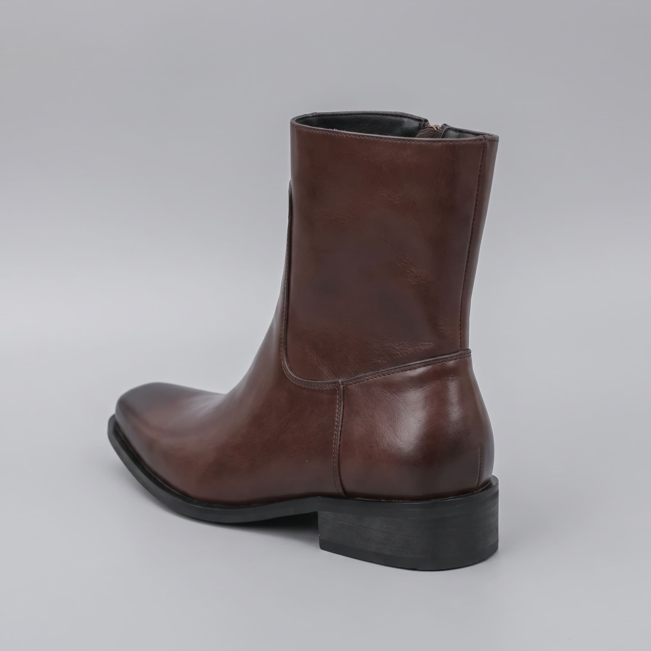 FORCIANO AURESTO brown height increasing boot with smooth microfiber upper shown from a rear three-quarter angle with heel and shaft visible.