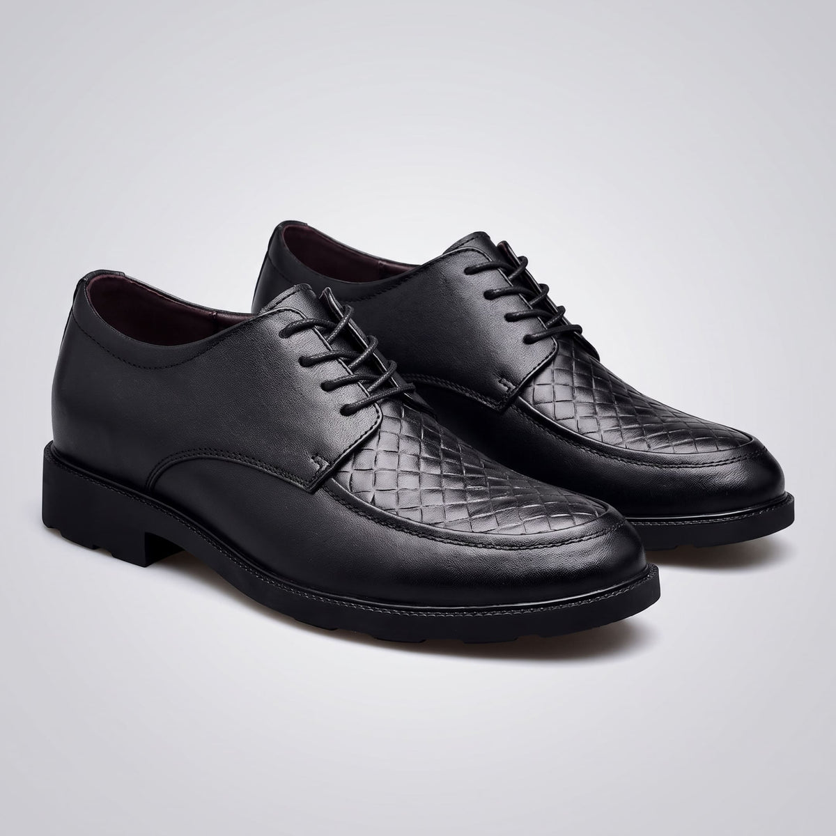 FORCIANO AUTHORITY Height Increasing Shoes in Black premium leather, displayed as a pair from a front angle with woven panels.