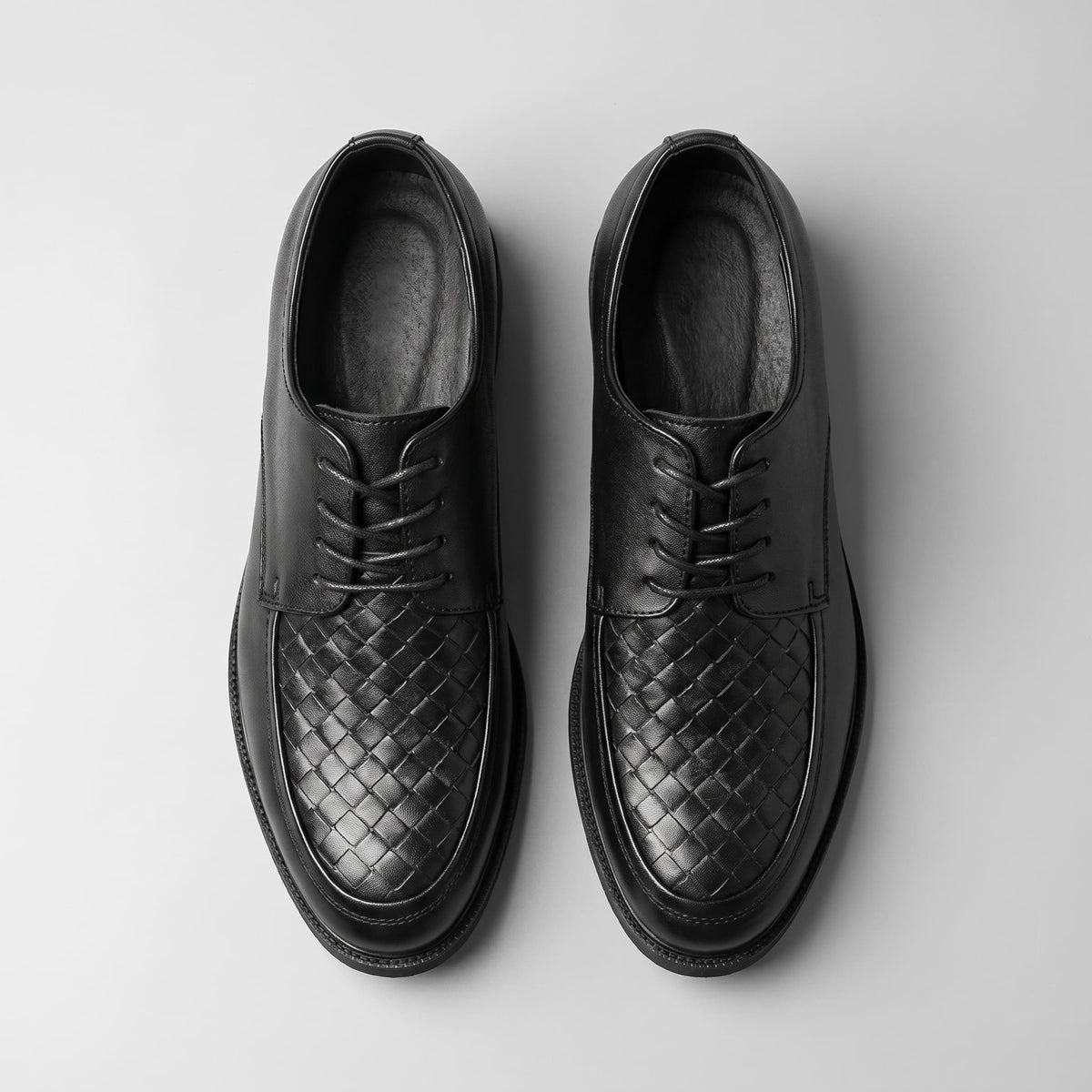 FORCIANO AUTHORITY Height Increasing Shoes in Black premium leather, displayed from the top with woven detailing and lace-up design visible.
