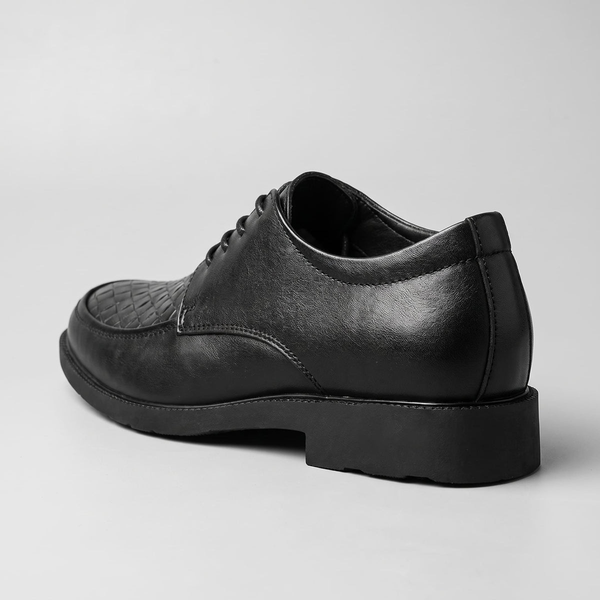 FORCIANO AUTHORITY Height Increasing Shoes in Black premium leather, shown from a rear three-quarter angle with the heel and side profile visible.