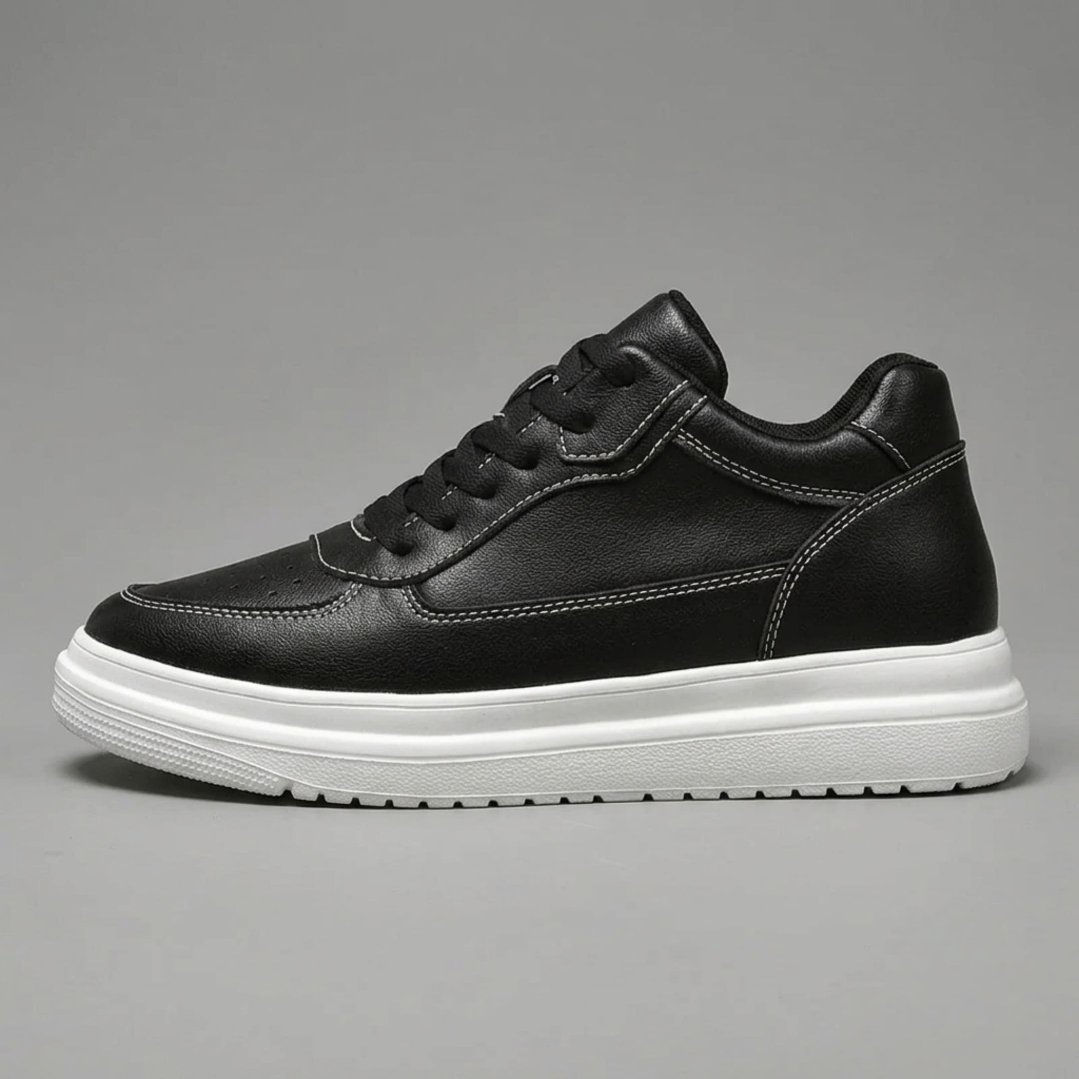 FORCIANO AVERY black height increasing shoes for women shown in side profile with premium leather upper, contrast stitching and white sole.