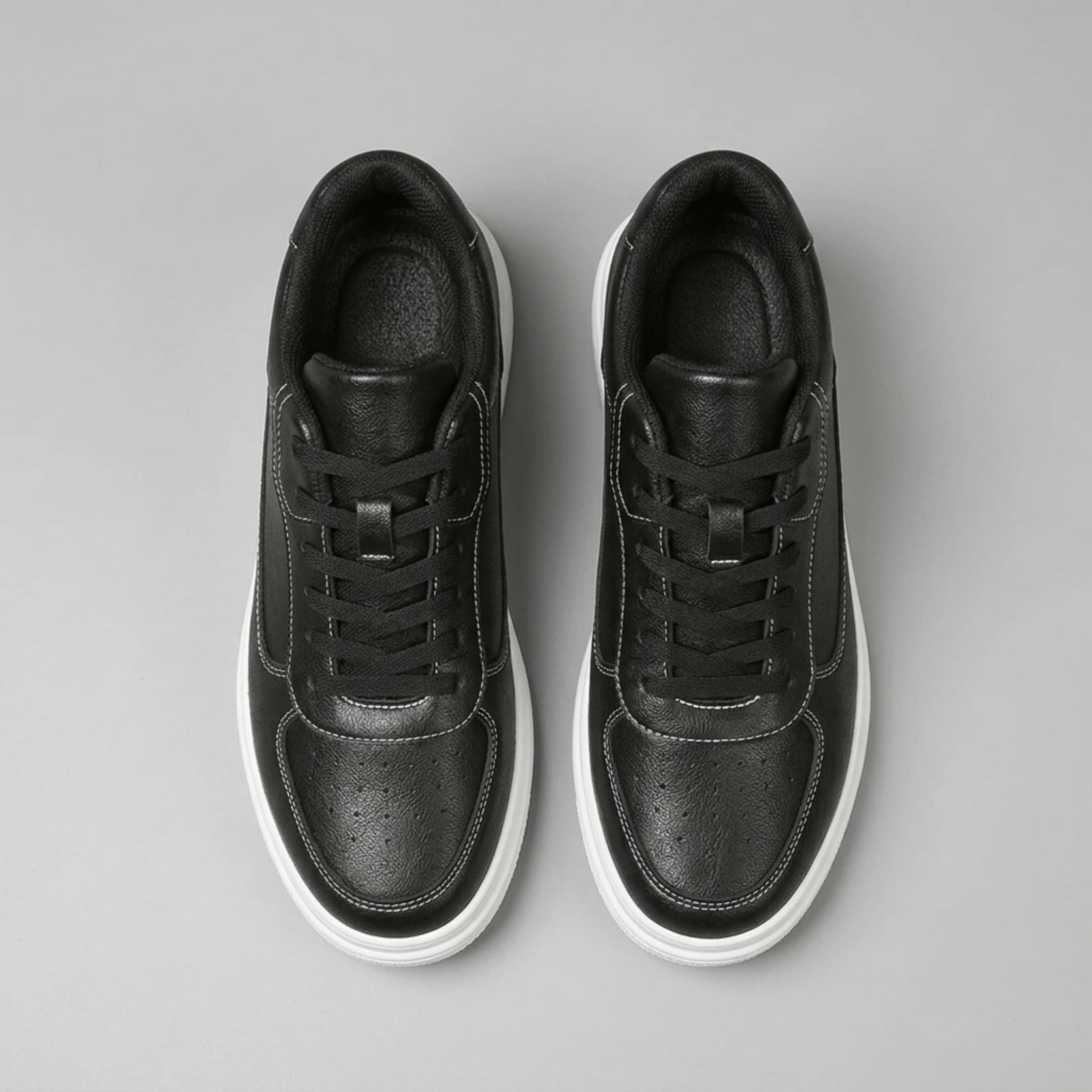 FORCIANO AVERY black sneakers for women in top view, showing black laces, perforated toe panels, contrast stitching and premium leather uppers.