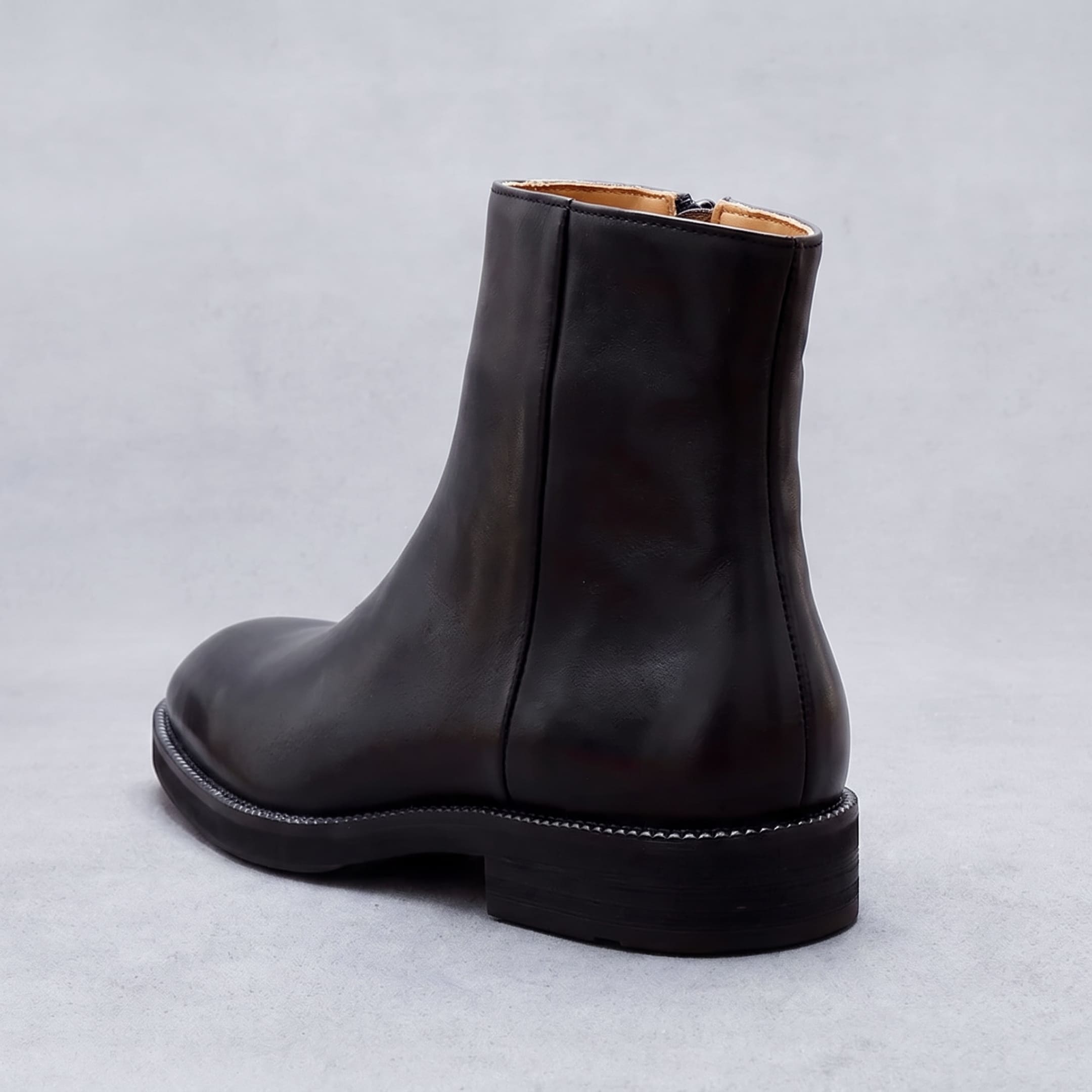 FORCIANO BELLANO black Elevator Boots with a genuine leather upper shown from a rear three-quarter view highlighting the heel and back seam.