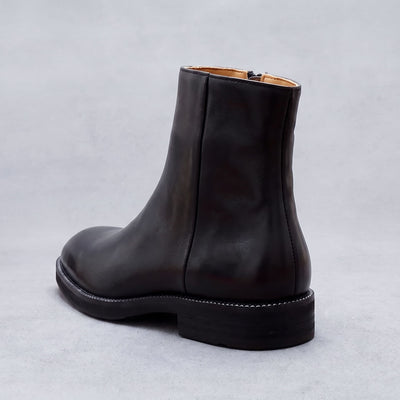 FORCIANO BELLANO black Elevator Boots with a genuine leather upper shown from a rear three-quarter view highlighting the heel and back seam.