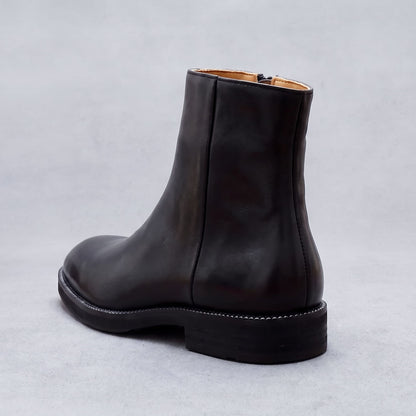 FORCIANO BELLANO black Elevator Boots with a genuine leather upper shown from a rear three-quarter view highlighting the heel and back seam.
