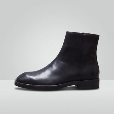 FORCIANO BELLANO black Elevator Boots with a genuine leather upper shown from a full side profile with low heel and ankle-height design.