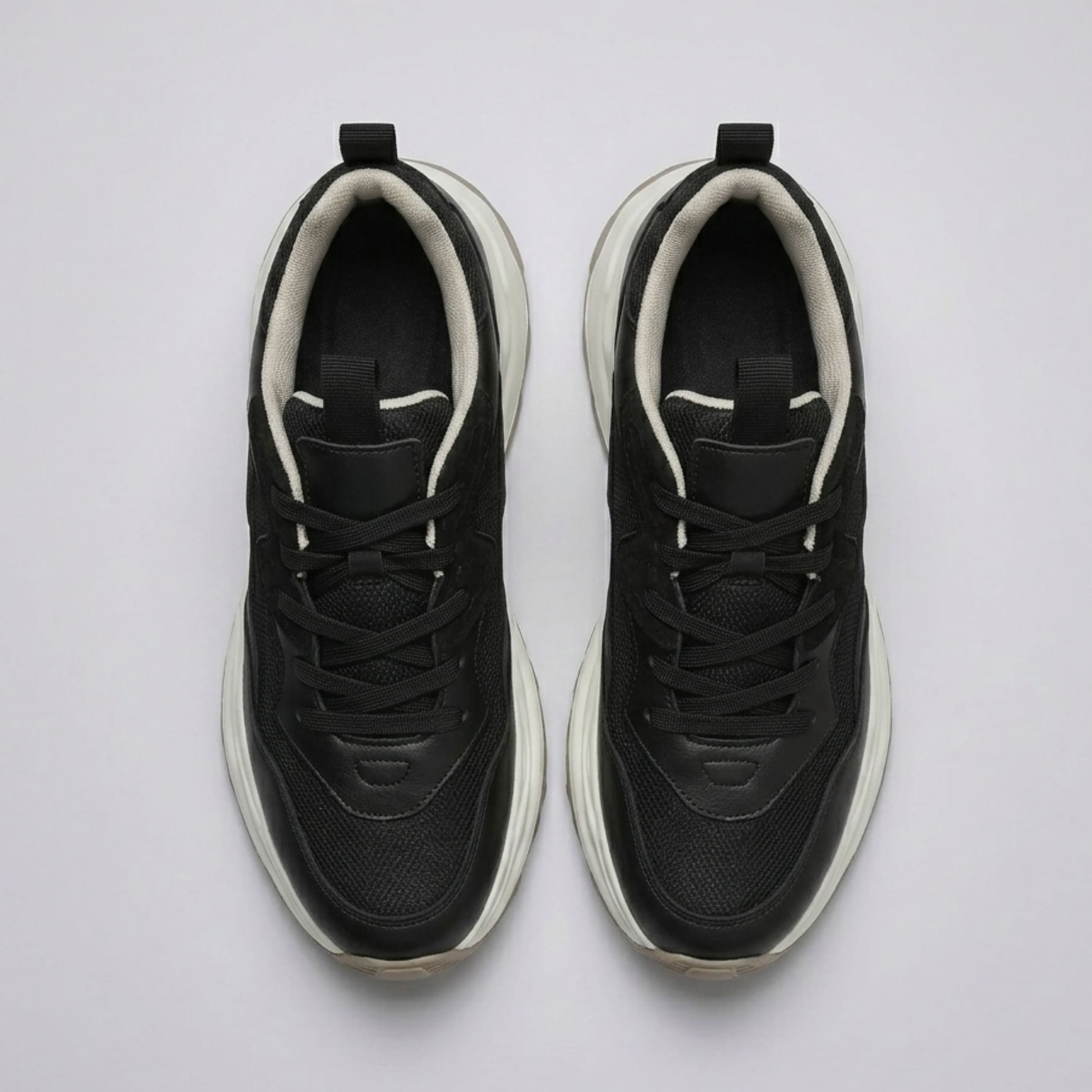 FORCIANO BELLUNO black height increasing sneakers with premium leather upper, shown as a pair from the top with laces and contrasting lining visible.