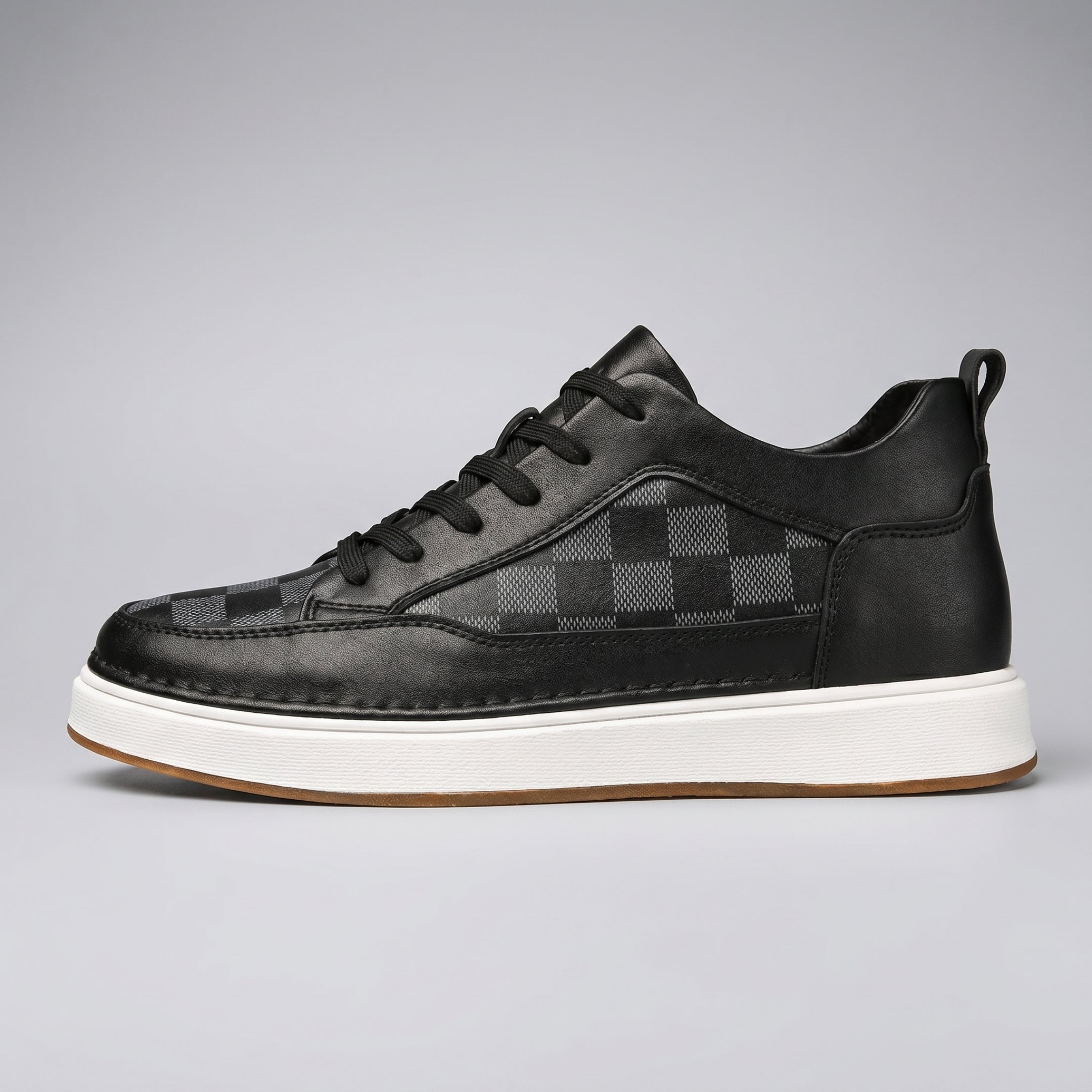 FORCIANO BELMONTE black leather Height Increasing Sneaker shown from the side profile with dark checkered panels, black laces and a white sole.