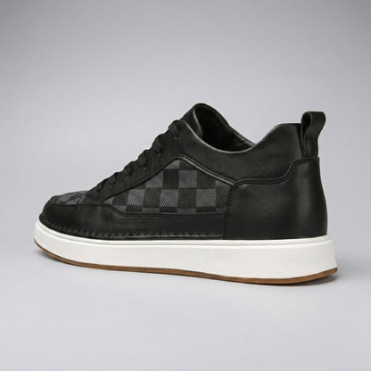 FORCIANO BELMONTE black leather Height Increasing Sneakers with a dark checkered side panel, shown from a rear three-quarter angle with the heel pull tab and white sole visible.