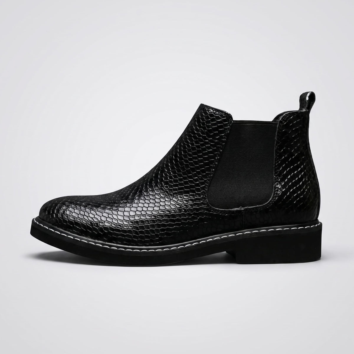 FORCIANO BRIXTON black women's elevator boot in side profile, showing the textured premium leather upper, elastic side panel and black sole.