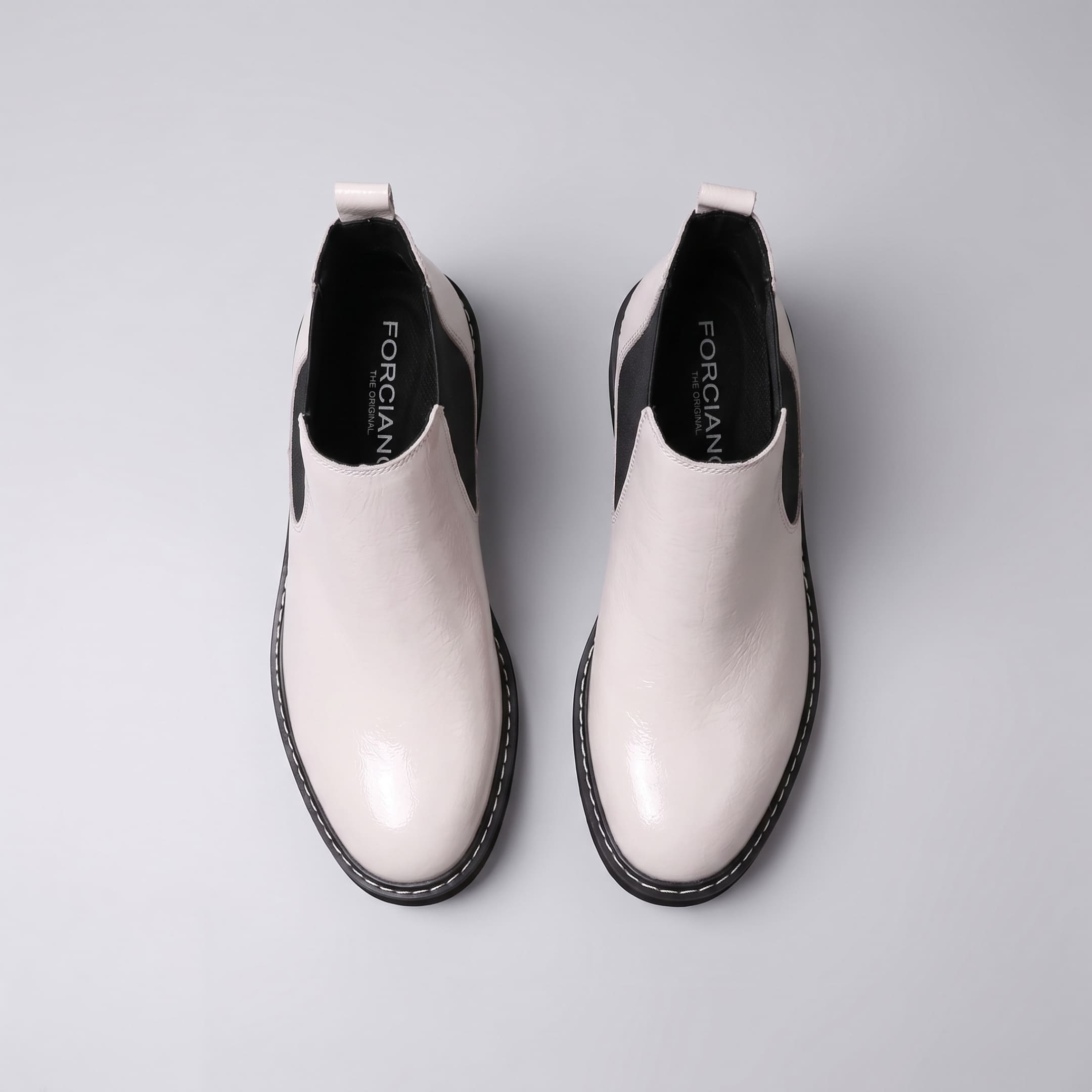 FORCIANO BRIXTON white women's elevator boots shown as a pair from above, with premium leather uppers, black interiors and side elastic inserts.