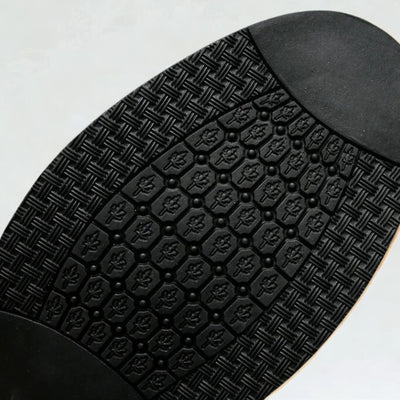 Close-up outsole view of FORCIANO BRIXTON Women's Elevator Boots showing the black tread pattern