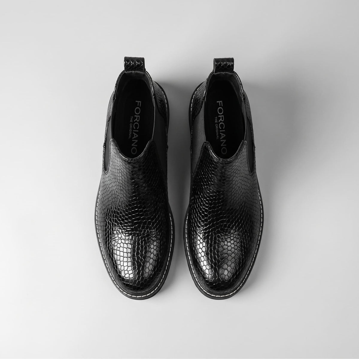 Top-down view of black premium leather FORCIANO BRIXTON Women's Elevator Boots shown as a pair