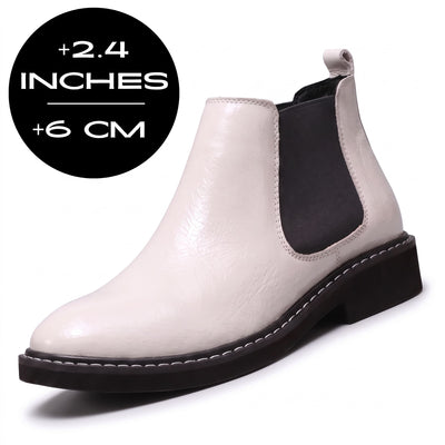 White FORCIANO BRIXTON Women's Elevator Boots shown from a front three-quarter angle, featuring a smooth finish, black elastic side panel, and 2.4" / 6 cm height increase.
