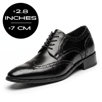 FORCIANO BROGUE black premium leather elevator dress shoe in front three-quarter view with visible 7 cm / 2.8" height increase graphic.