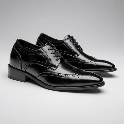 FORCIANO BROGUE black premium leather elevator dress shoes shown as a pair from a front three-quarter angle with polished brogue detailing.