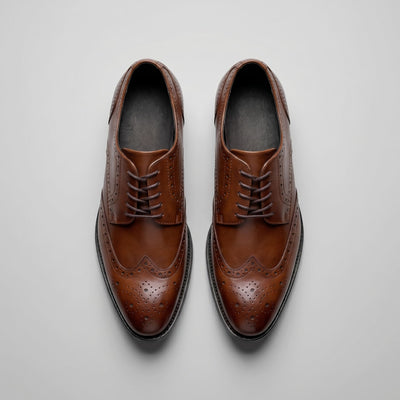 FORCIANO BROGUE brown premium leather elevator dress shoes shown as a pair from the top, highlighting laces and wingtip brogue detailing.