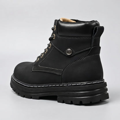 FORCIANO CALIBER black elevator boot with premium suede upper shown from a rear three-quarter angle with heel loop and chunky sole visible.