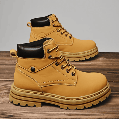 FORCIANO CALIBER light brown elevator boots with premium suede uppers shown as a pair on a wooden surface in a casual product setting.