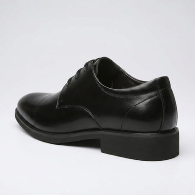 Rear three-quarter view of a FORCIANO CAVELLO black elevator dress shoe with premium leather upper showing the heel construction and side profile.