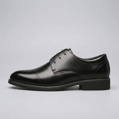 Side profile of a FORCIANO CAVELLO black elevator dress shoe with premium leather upper, lace-up front and polished Oxford finish.