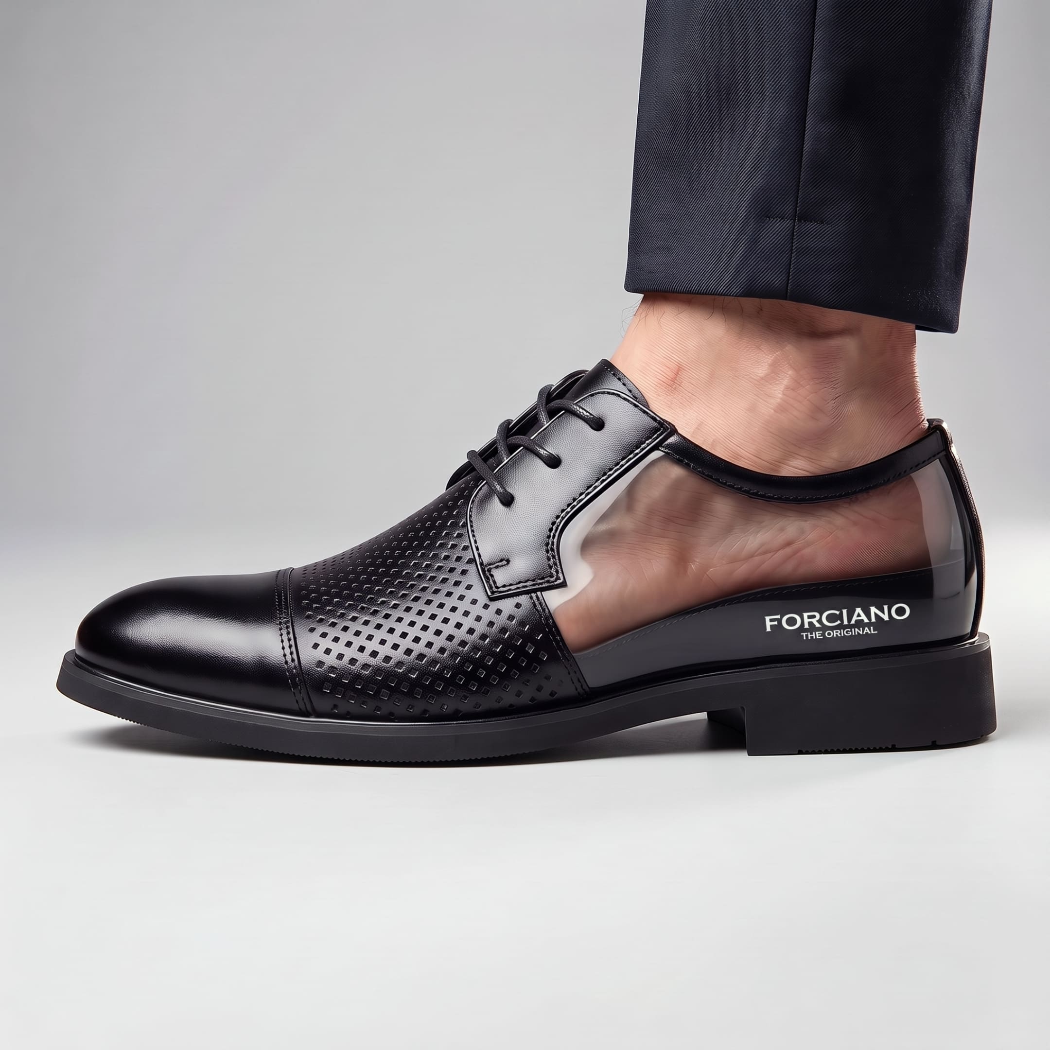 On-foot cutaway view of FORCIANO CAVELLO black perforated elevator dress shoes with a premium leather upper showing the internal heel-lift area.
