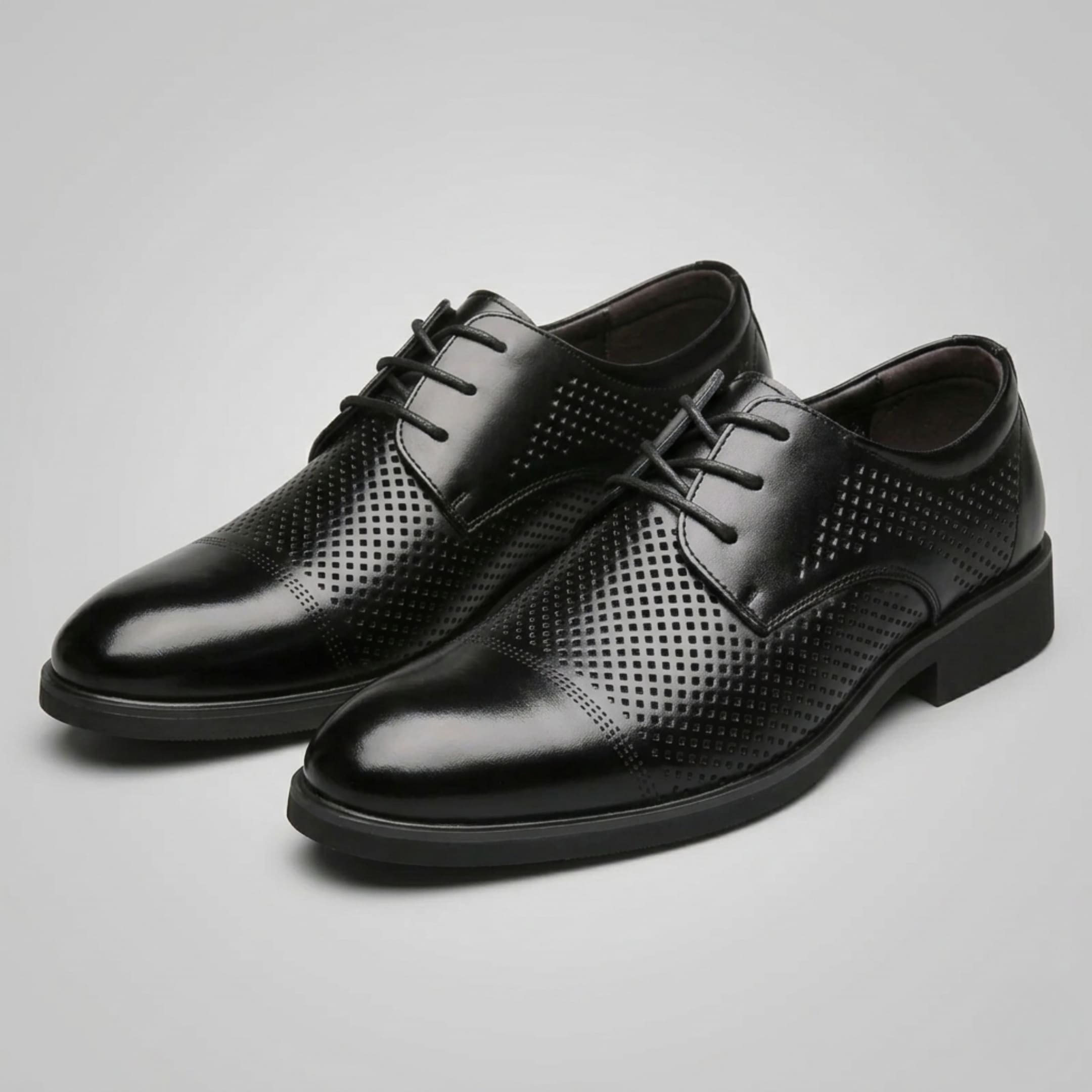 Pair of FORCIANO CAVELLO black perforated elevator dress shoes with premium leather uppers displayed from a front three-quarter angle.