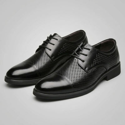 Pair of FORCIANO CAVELLO black perforated elevator dress shoes with premium leather uppers displayed from a front three-quarter angle.