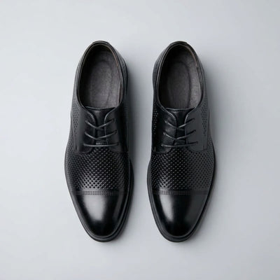 Top view of FORCIANO CAVELLO black perforated elevator dress shoes with premium leather uppers and patterned perforations across the vamp.