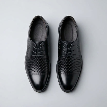 Top view of FORCIANO CAVELLO black perforated elevator dress shoes with premium leather uppers and patterned perforations across the vamp.