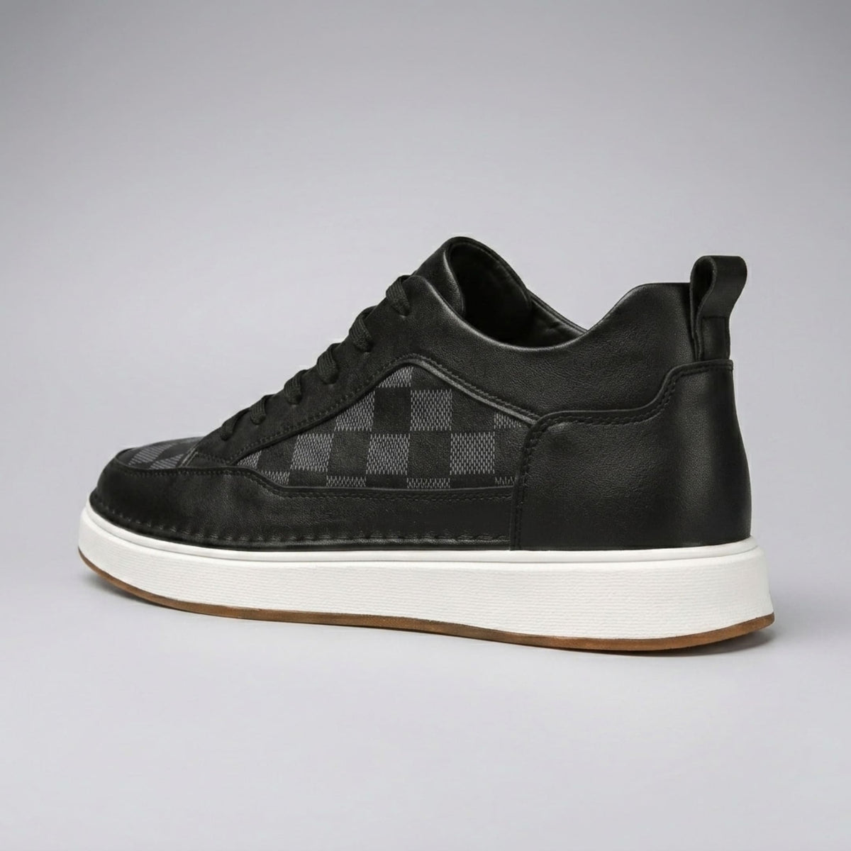 FORCIANO CELESTE black women's sneaker shown from a rear three-quarter angle with premium leather upper, heel pull tab and white sole.
