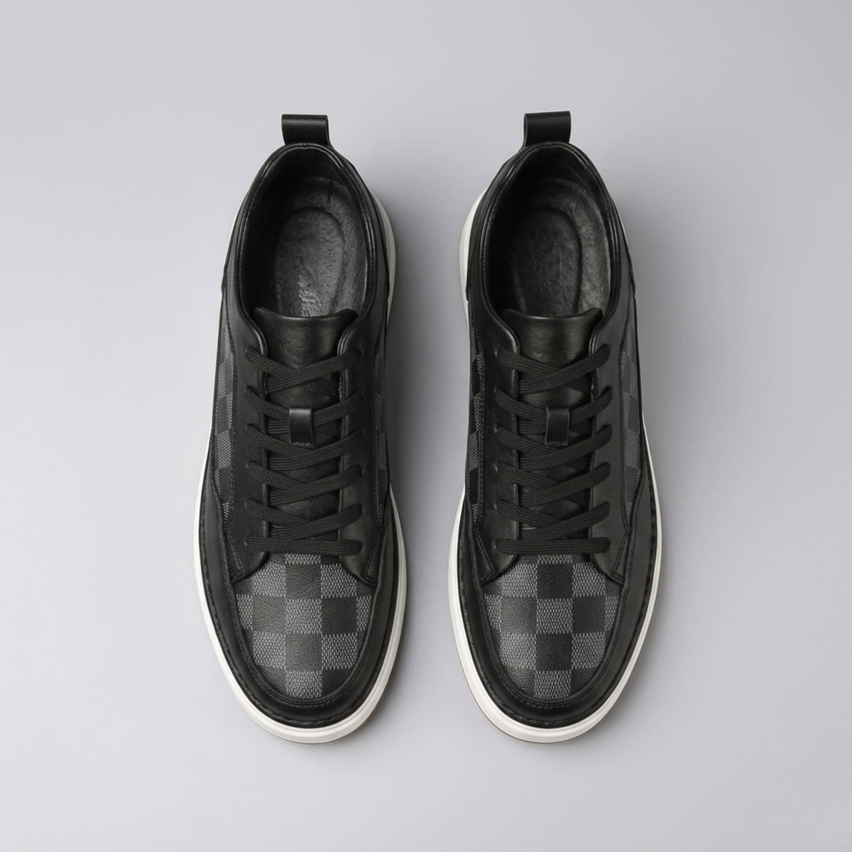 FORCIANO CELESTE black women's platform sneakers shown as a pair from the top with premium leather uppers, black laces and check-pattern toe panels.