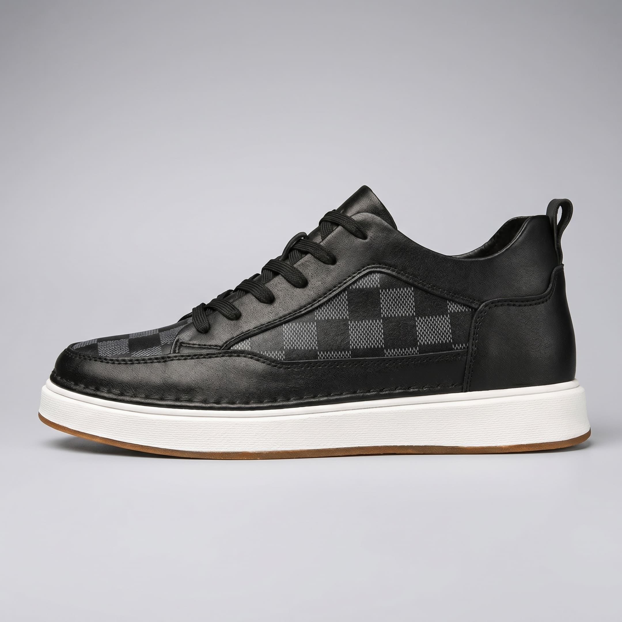 FORCIANO CELESTE black women's platform sneakers in side profile with premium leather upper, check-pattern panels and white sole.
