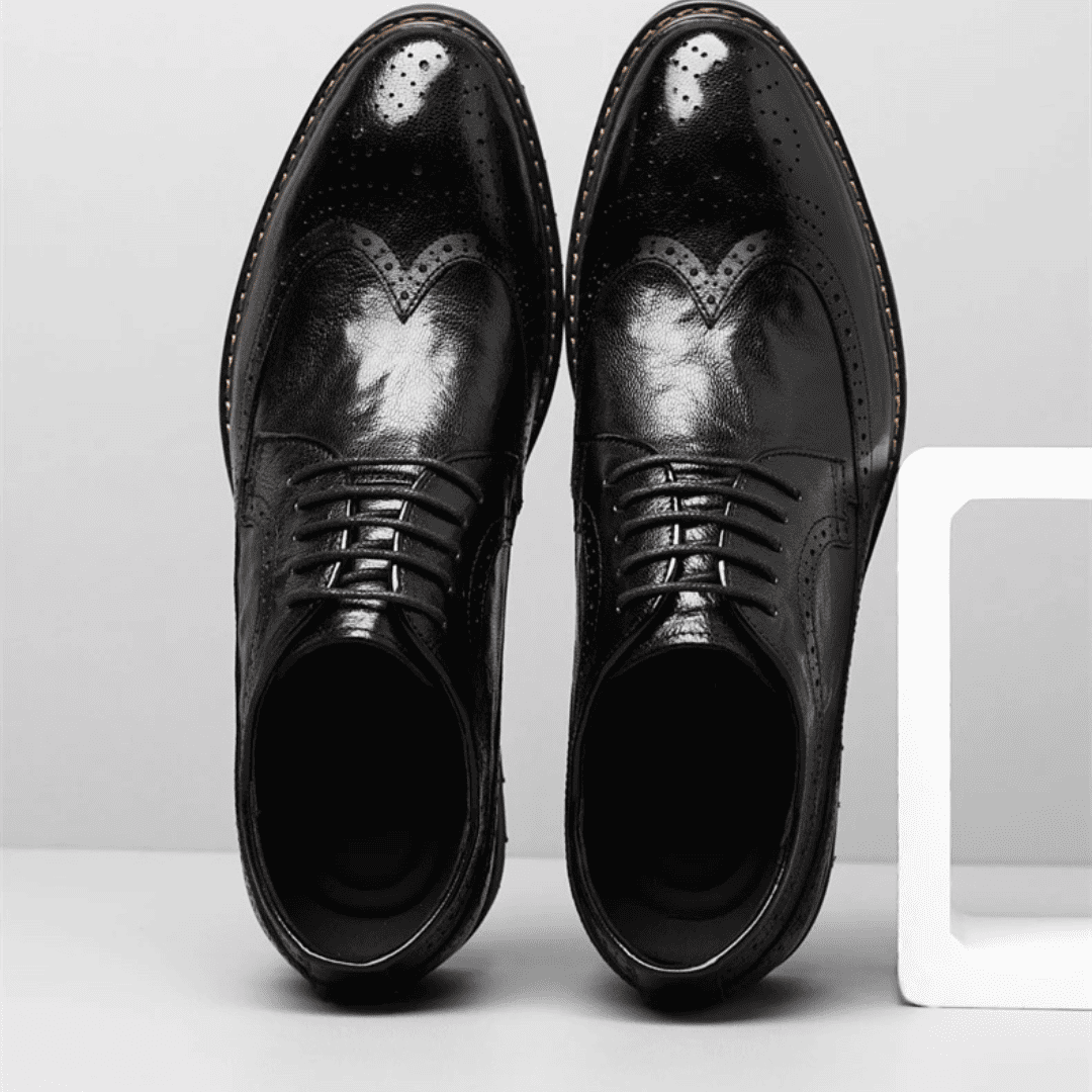 FORCIANO CELSUS black premium leather elevator dress shoes shown as a pair from above with wingtip-style perforated detailing and laces.