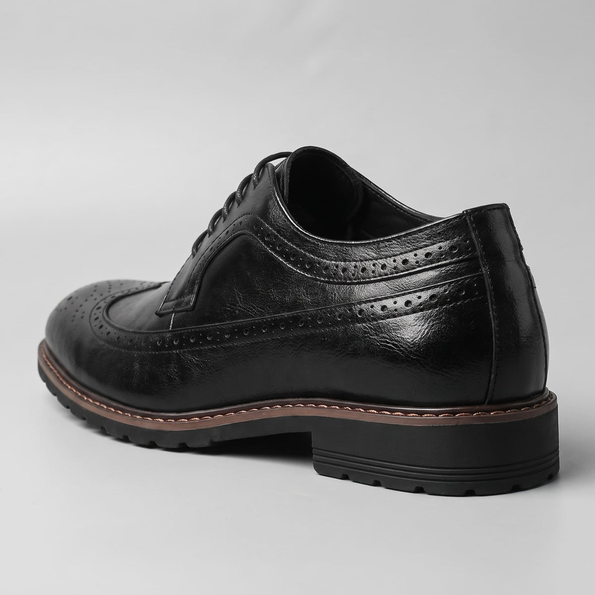 FORCIANO CELSUS Elevator Dress Shoes in black premium leather shown from the rear three-quarter angle with heel and side detailing visible.