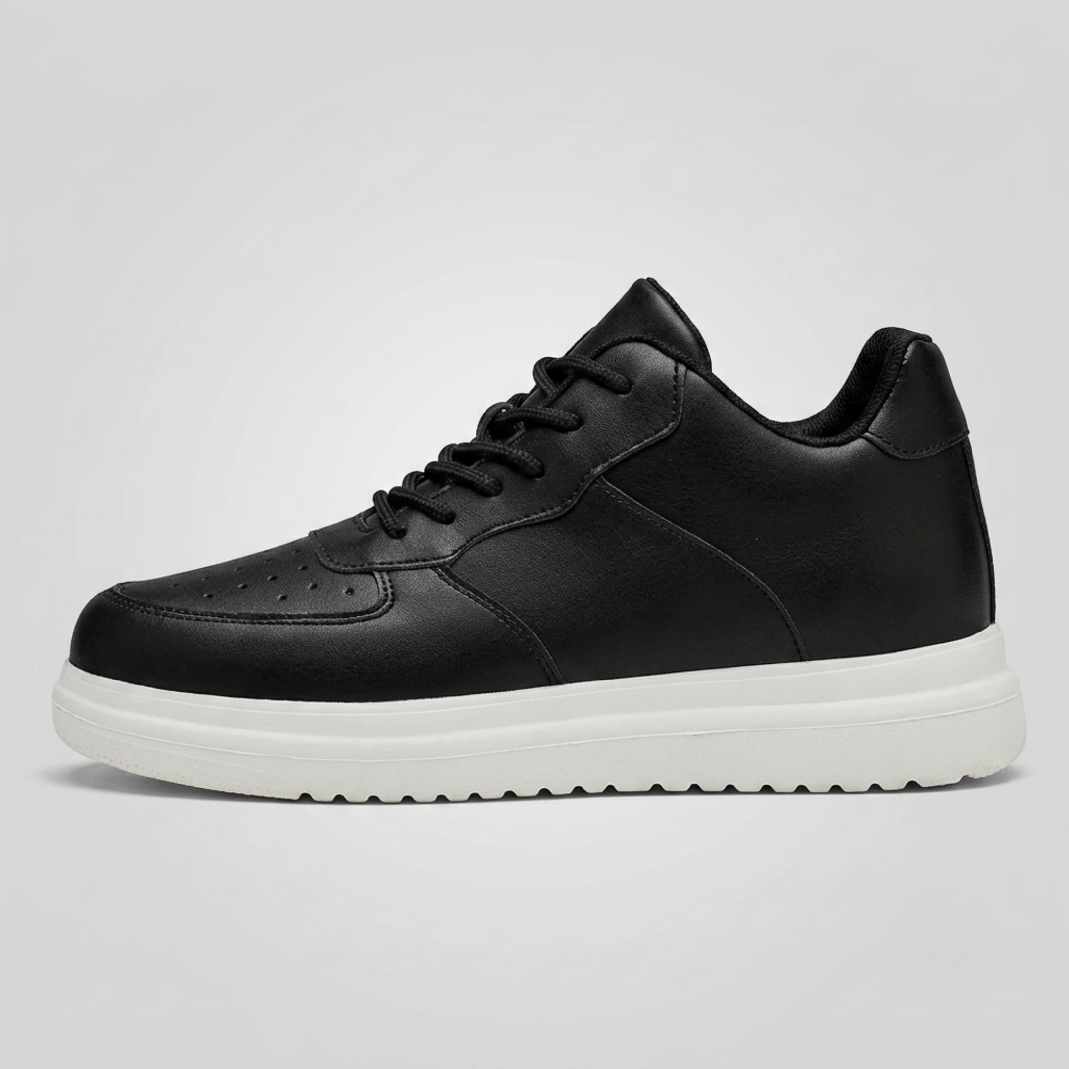 FORCIANO CHAMPION black sneaker shown from the side with black laces, perforated toe detailing, and a contrasting white raised sole.