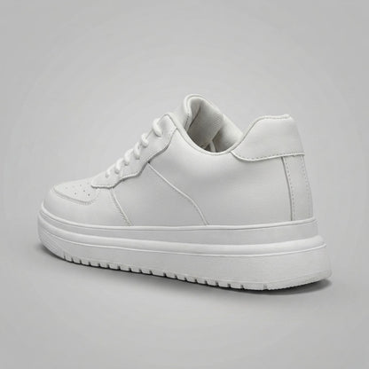 FORCIANO CHAMPION white sneaker shown from a rear three-quarter angle, highlighting the heel construction and raised white sole.