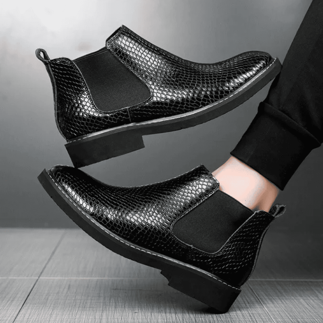 FORCIANO CROXTON black textured leather elevator boots worn on foot in a side-angle lifestyle view.