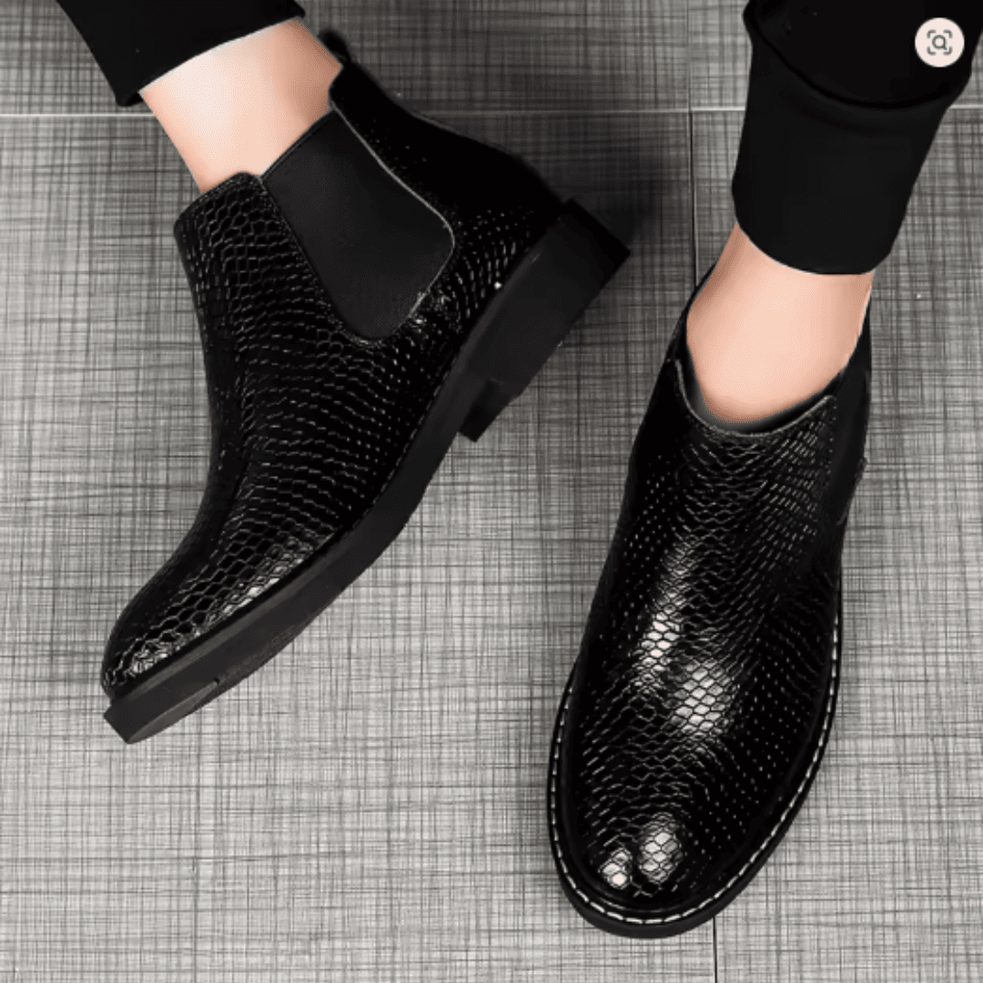 FORCIANO CROXTON black textured leather elevator boots worn on foot in a top-view lifestyle image.