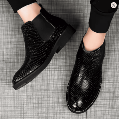 FORCIANO CROXTON black textured leather elevator boots worn on foot in a top-view lifestyle image.