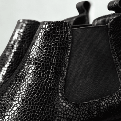 FORCIANO CROXTON black textured leather Chelsea boots close-up focusing on the glossy upper pattern and black elastic gusset.