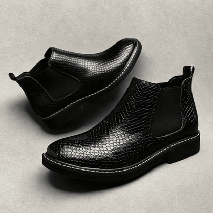 FORCIANO CROXTON black textured leather elevator boots arranged as a pair, with one boot tilted to show the side and sole.