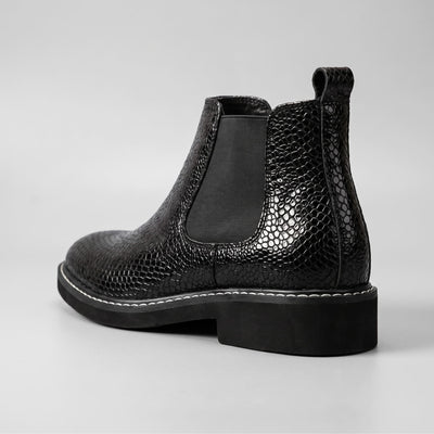 FORCIANO CROXTON Elevator Boots in black premium leather shown from a rear three-quarter angle with textured upper