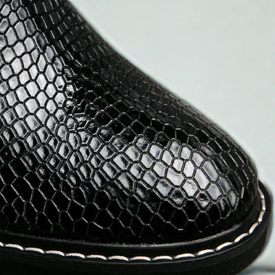 FORCIANO CROXTON Elevator Boots in black premium leather shown in a close-up of the glossy textured upper and welt stitching