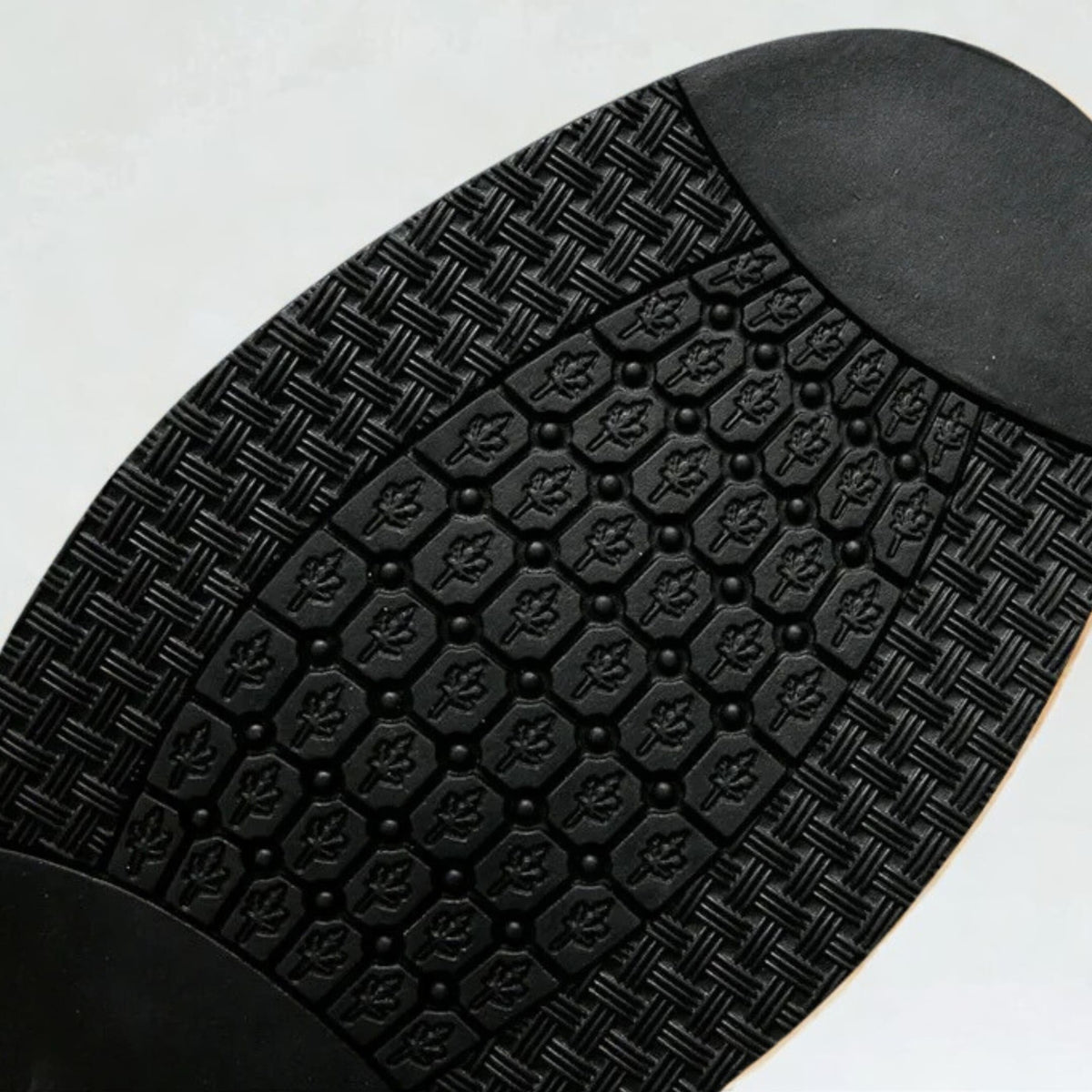 FORCIANO CROXTON Elevator Boots shown in a close-up view of the black patterned outsole