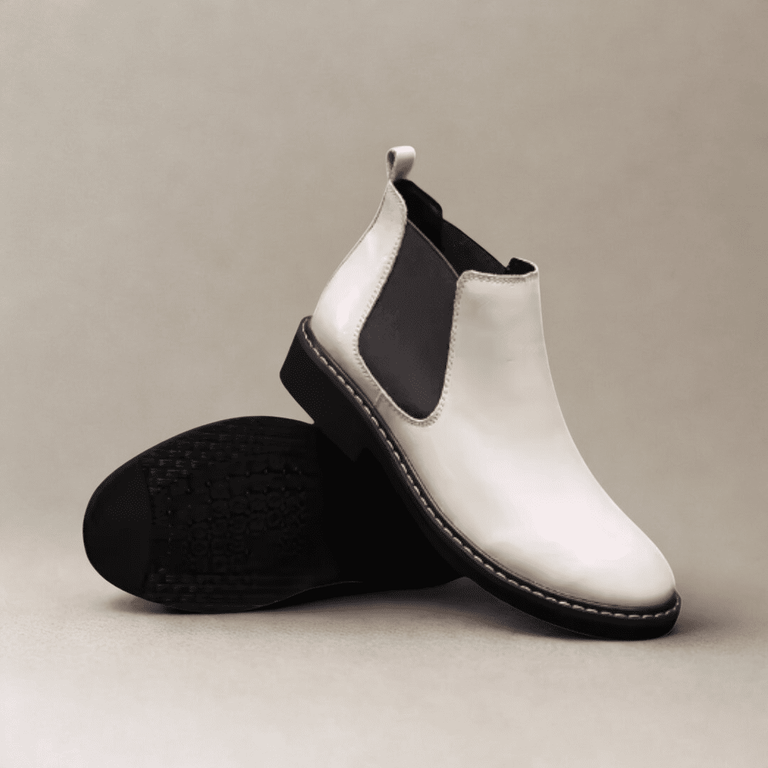 FORCIANO CROXTON white leather Chelsea boots displayed as a pair, with one boot upright and the other showing the outsole.