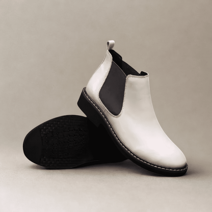 FORCIANO CROXTON white leather Chelsea boots displayed as a pair, with one boot upright and the other showing the outsole.